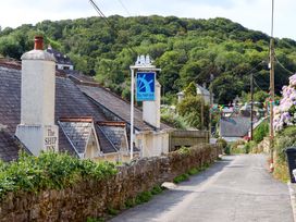 A view of The Ship Inn along a road in Newton Ferrers