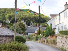 A street with houses and decorations at The Porthole in Newton Ferrers