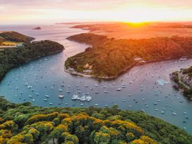 A river with boats during sunset at The Porthole in Newton Ferrers