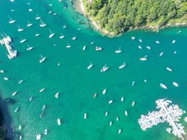 An aerial view of boats in a bay at The Porthole in Newton Ferrers