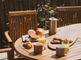 A table with cups and pastries at The Porthole in Newton Ferrers