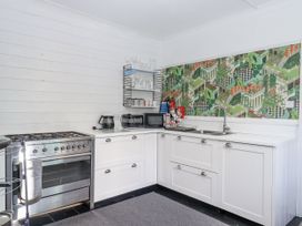 A kitchen with cabinets and appliances at 26 Above Town in Dartmouth