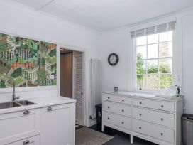 A kitchen with a sink and drawers at 26 Above Town in Dartmouth