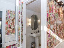 A bathroom with a sink and mirror at 26 Above Town in Dartmouth