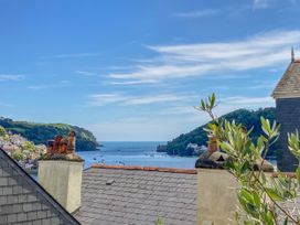 A view of the sea and boats from a rooftop at 26 Above Town in Dartmouth