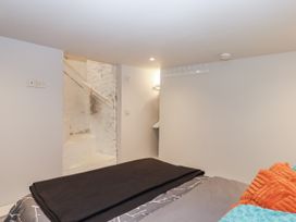 A bedroom with a staircase leading out at 26 Above Town Dartmouth
