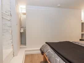 A bedroom with a bed and a closet at 26 Above Town Dartmouth