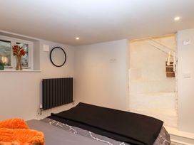 A bedroom with a bed and window at 26 Above Town Dartmouth