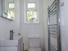A bathroom with a sink and toilet at Kiln Cottage Golant near Tywardreath