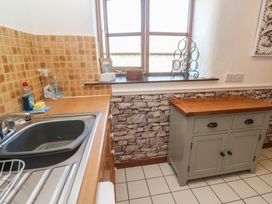 A kitchen with sink and cabinet at Mill House Barn in Gulval near Penzance
