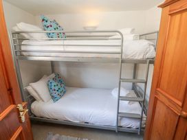 A bunk bed with pillows in a bedroom at Mill House Barn Gulval near Penzance