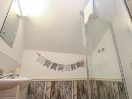 A bathroom with a shower and a sink at Mill House Barn Gulval near Penzance