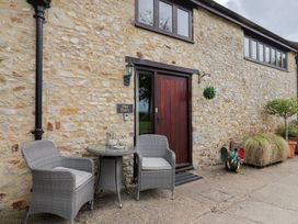 An outdoor area with chairs and a table at The Dairy