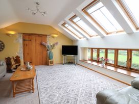 A living room with a sofa and coffee table at The Dairy