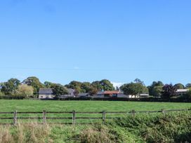 A view of houses and trees in a field at The Dairy in 
