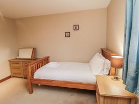 A bedroom with a single bed and a dresser at Pasture View Sneatonthorpe near Whitby