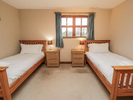 A bedroom with two beds and nightstands at Pasture View near Whitby