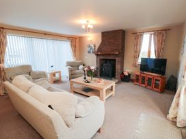 A living room with furniture including a sofa and television at Pasture View Sneatonthorpe near Whitby
