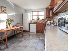 A kitchen with a dining table and chairs at Beck View in Whitby
