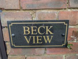 A nameplate on a brick wall at Beck View in Whitby