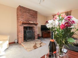 A living room with a fireplace and coffee table at Beck View in Whitby
