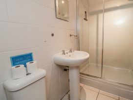 A bathroom with a sink and a shower at Wheelhouse Cottage Sneatonthorpe near Whitby