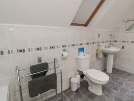 A bathroom with a sink and toilet at Wheelhouse Cottage in Sneatonthorpe near Whitby