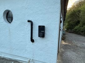 An electric charger mounted on a wall at Hafod Y Graig in Morfa Bychan