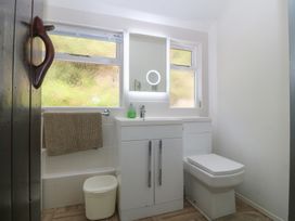 A bathroom with a sink and toilet at Seaview Hafod Y Graig Morfa Bychan