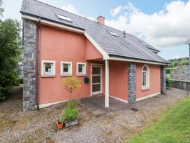 A house exterior with a door and windows at 25 Ring of Kerry Holiday Cottages Kenmare