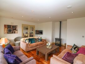 A living room with sofas and a coffee table at 25 Ring of Kerry Holiday Cottages in Kenmare