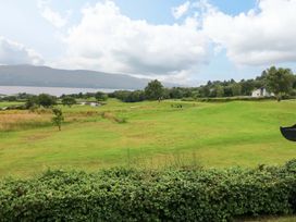 A landscape view with trees and a lake at 25 Ring of Kerry Holiday Cottages Kenmare