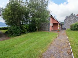 A house with a pathway in front at 25 Ring of Kerry Holiday Cottages Kenmare
