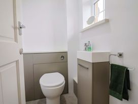 A bathroom with a toilet and sink at The Cottage Middle Westwater