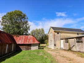 An outdoor view of buildings and trees at The Cottage Middle Westwater in Westwater Nr Axminster