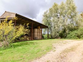A shelter with hay bales and trees at The Cottage Middle Westwater Westwater Nr Axminster