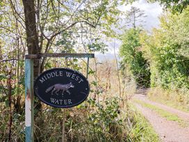 A sign for Middle West Water along a path in Westwater Nr Axminster