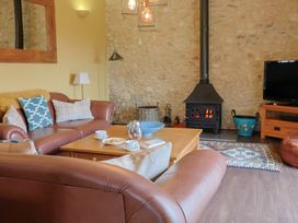 A living room with a sofa and coffee table at The Sundowner in Wyke Nr. Axminster
