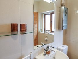 A bathroom with a mirror and sink at The Sundowner in Wyke Nr. Axminster