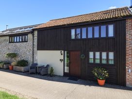 An exterior view of a house with a garden area at The Granary Wyke Nr Axminster