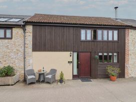An outdoor area with seating and plants at The Granary in Wyke Nr Axminster