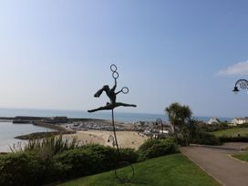 A sculpture by the sea with beach and boats at The Granary in Wyke Nr Axminster