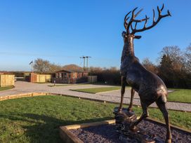 A deer statue in front of a lodge at Meadows Park 1 Great Hatfield near Hornsea