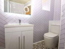 A bathroom with a sink and toilet at Cae Gwyn Ty Croes