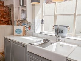 A kitchen with a sink and counter at Greenfingers in Whitby