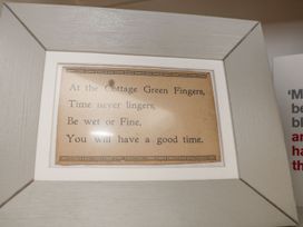 A framed print with a poem at Greenfingers in Whitby
