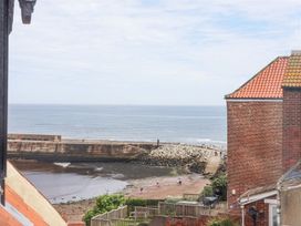 A view of the harbor and pathway at Greenfingers in Whitby