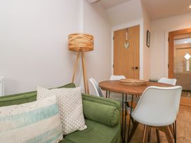 A dining room with a table and chairs at Wansfell Nook in Ambleside
