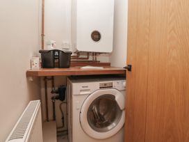 A laundry room with a washing machine and boiler at Wansfell Nook in Ambleside