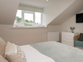 A bedroom with a bed and window at Wansfell Nook in Ambleside